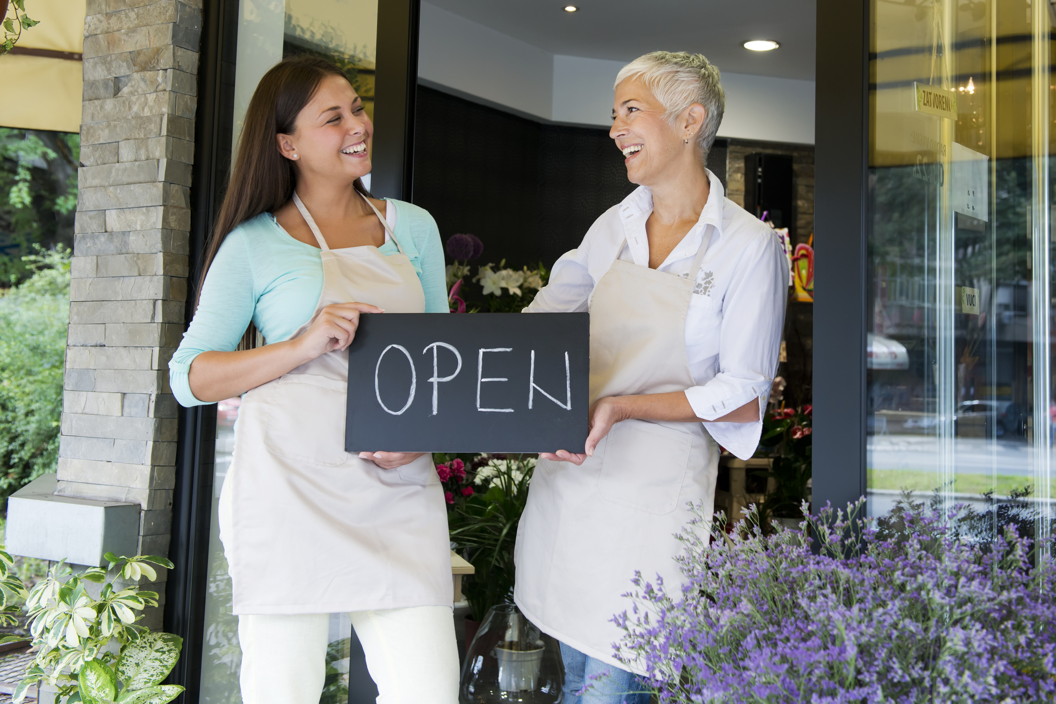 Two women opening a retail cannabis store practicing responsible sales