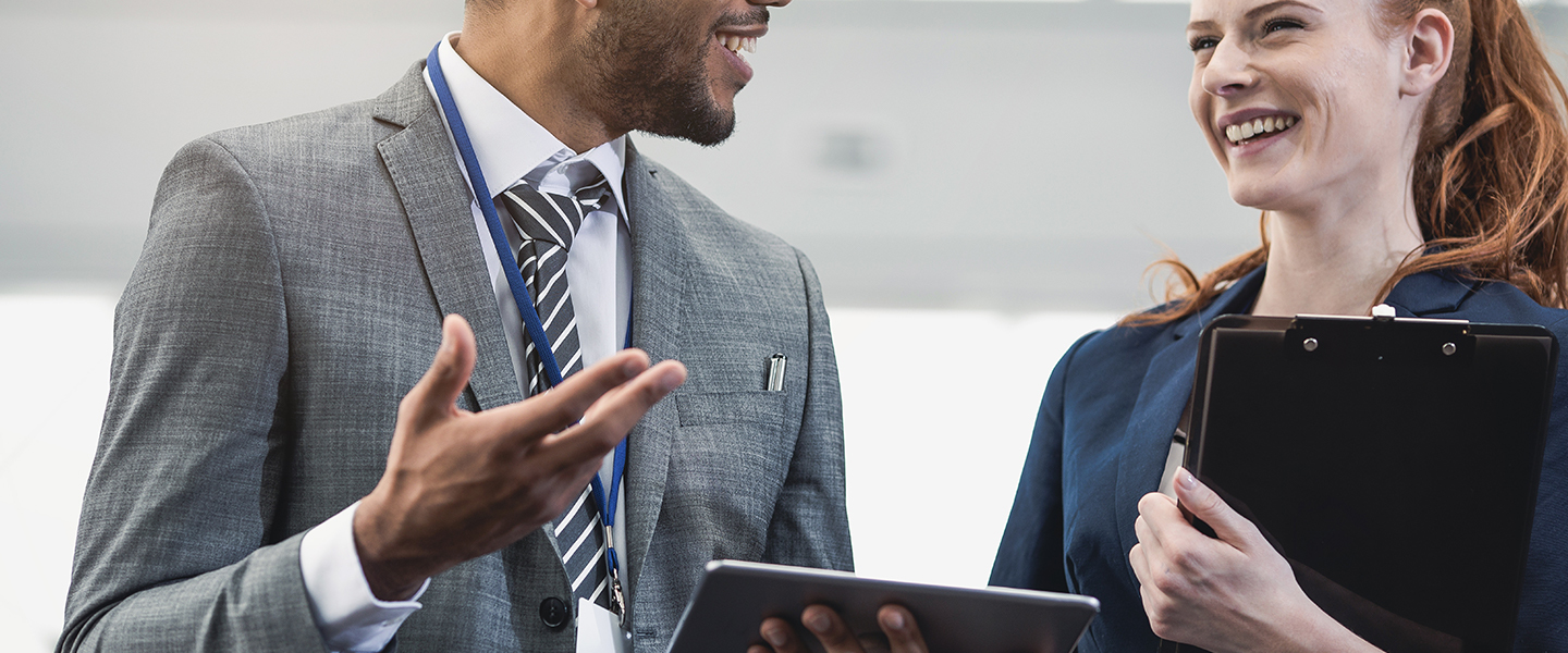 Co workers at a trade show nurturing leads